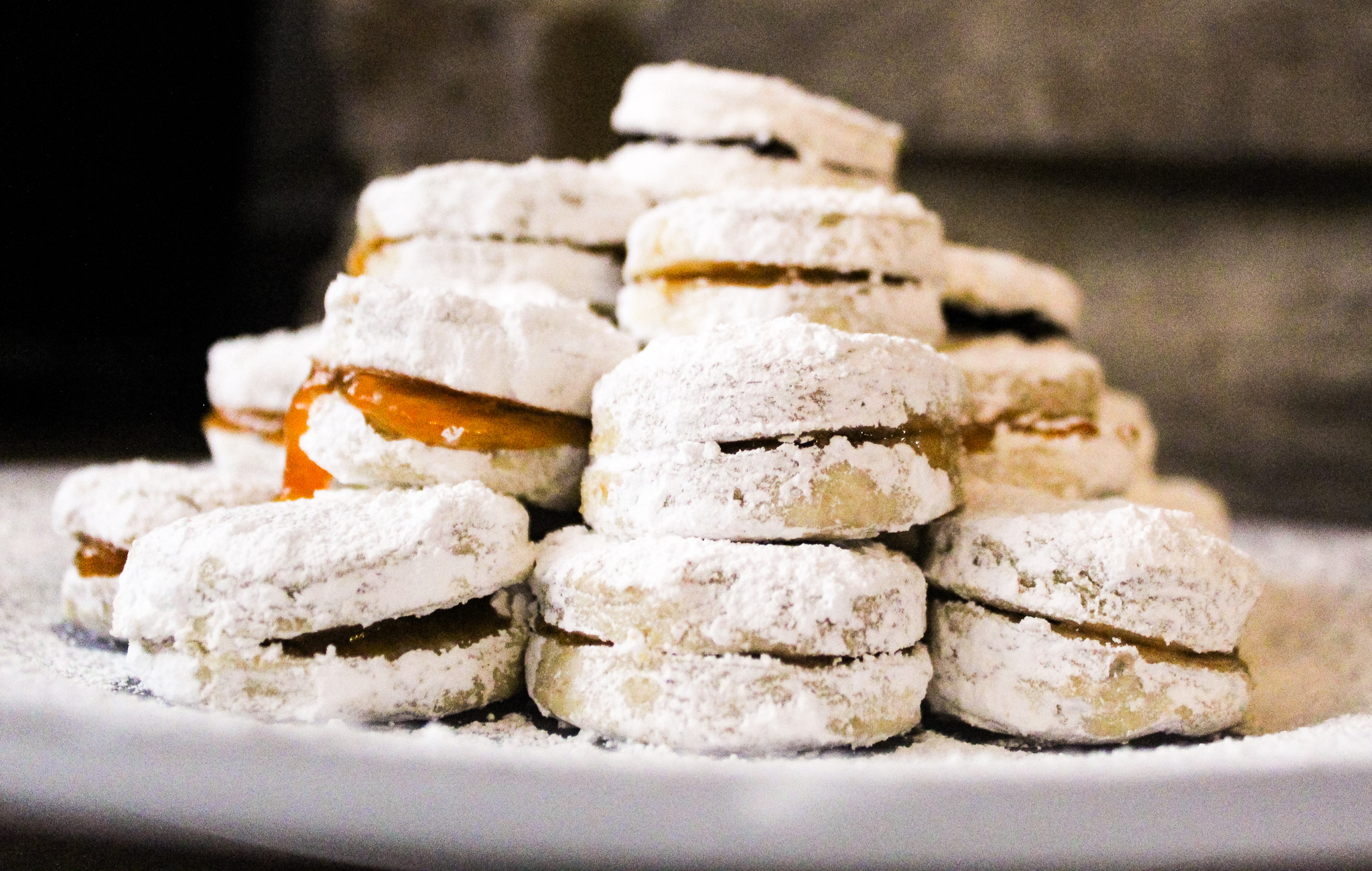 serbian vanilice recipe on a plate with powdered sugar dusted over vanilice